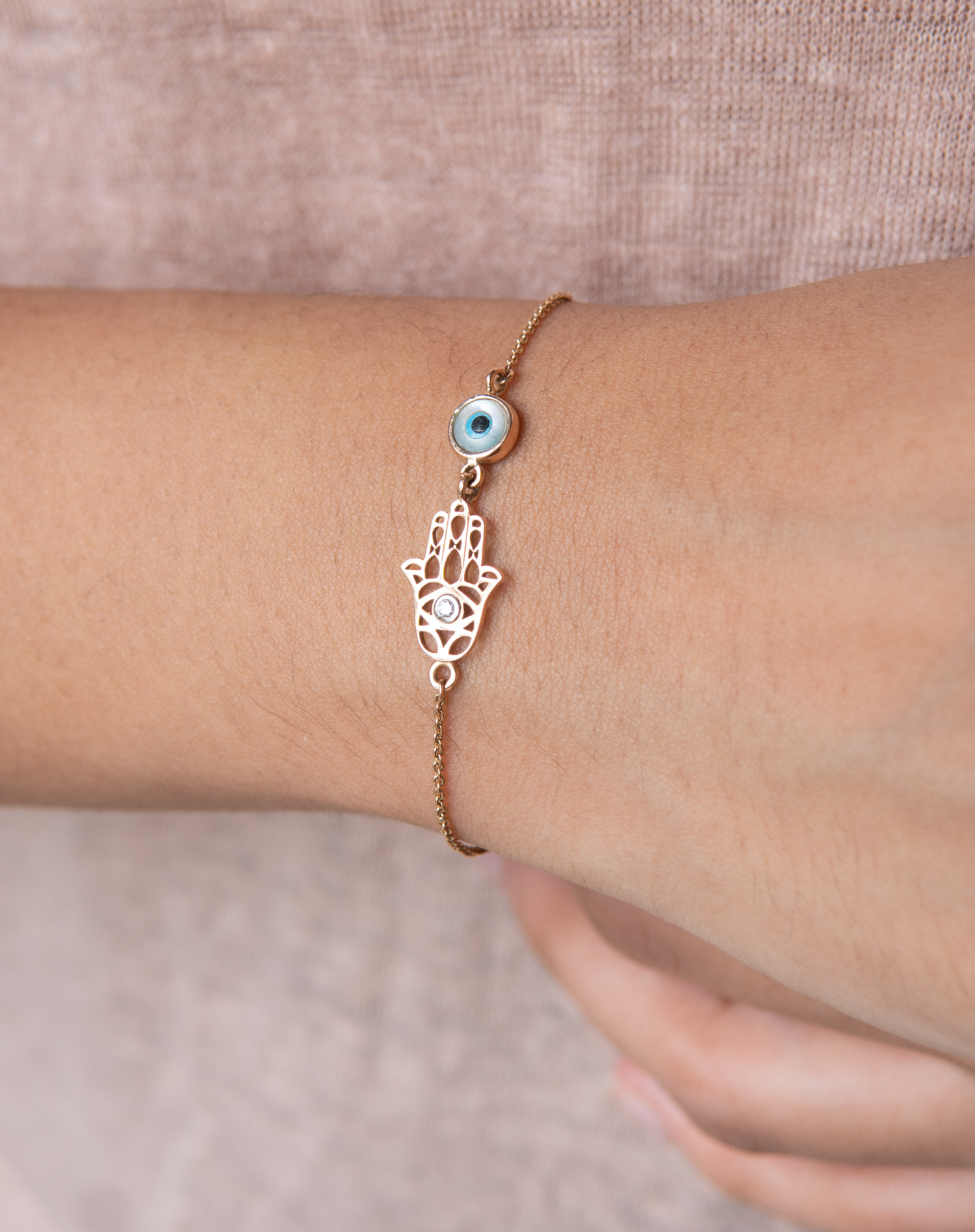 Buy Gold Plated Cubic Zirconia Hamsa Hand Embellished Bracelet by Zariin  Online at Aza Fashions.